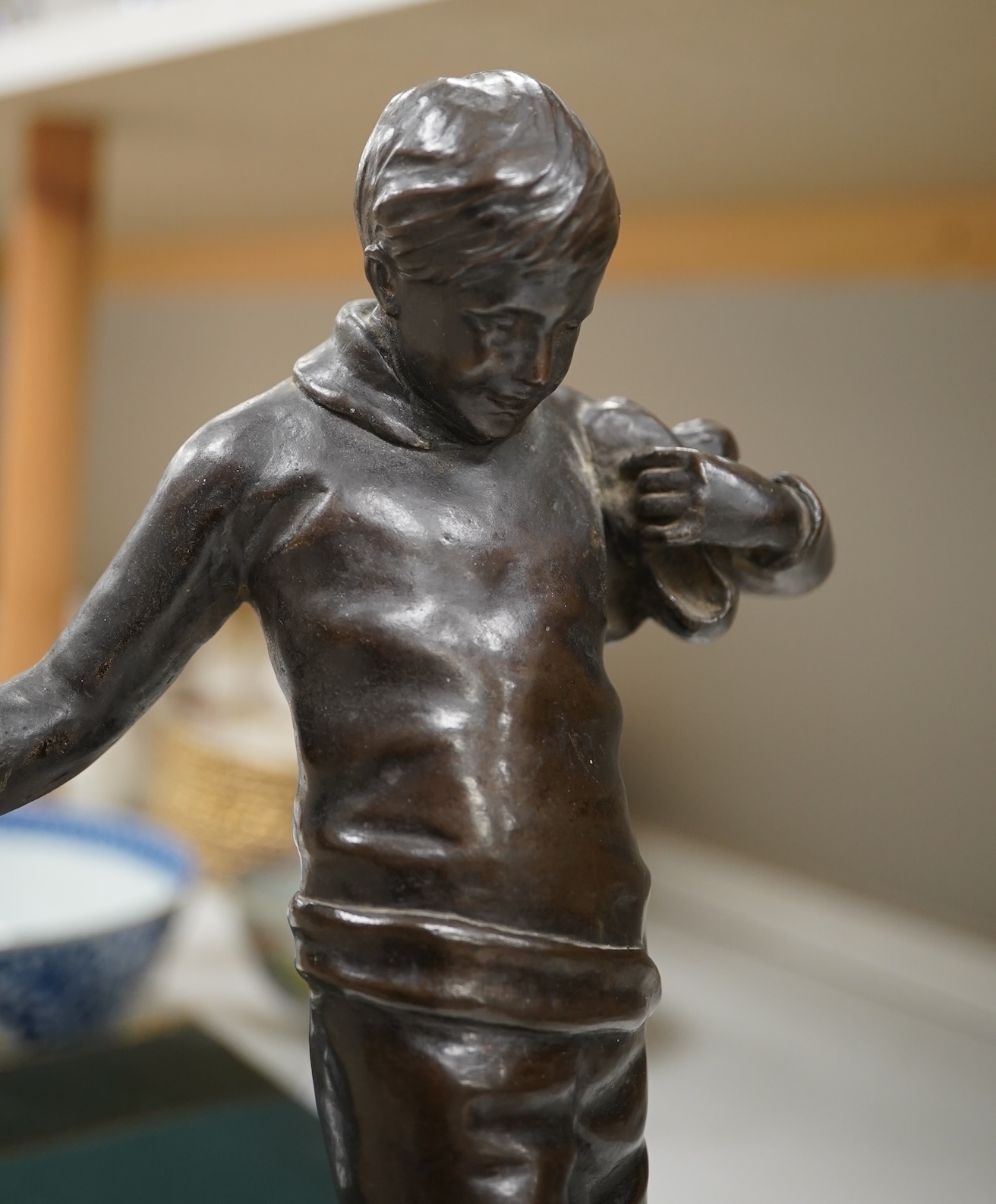 Lorna Adamson (British b.1894-?), an early 20th century bronze figure of a boy, signed and dated 1913, on marble base, 36cm. Condition - nibbles to base, otherwise good